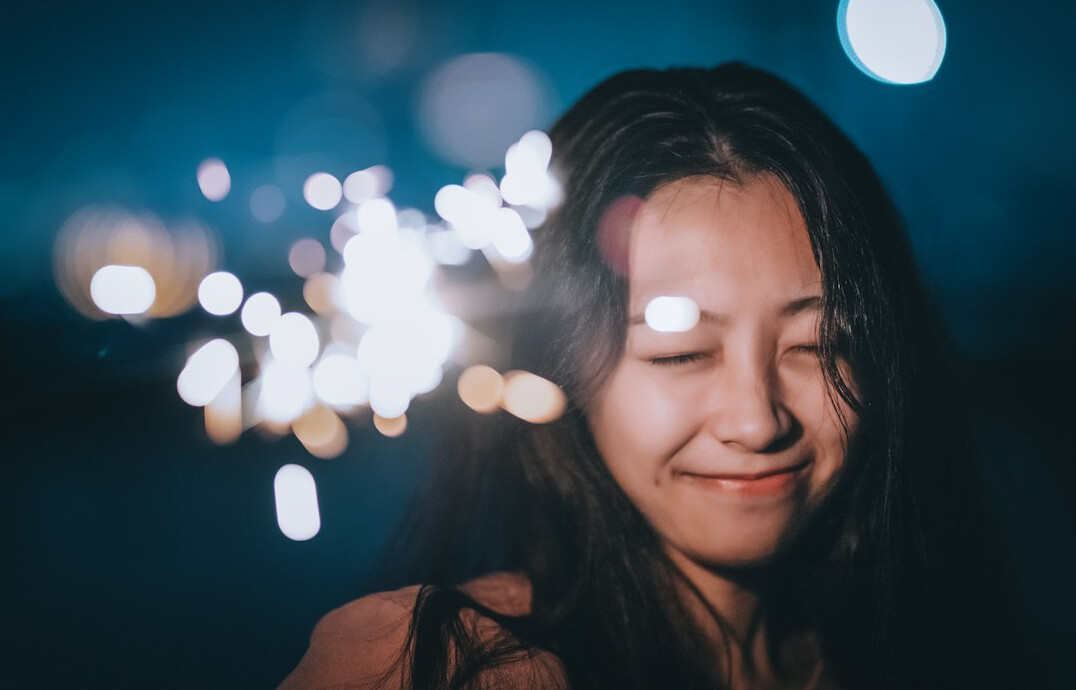 Portrait of a young woman with a warm smile
